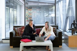 A professional photo of an attorney and client in discussion, emphasizing trust and communication.